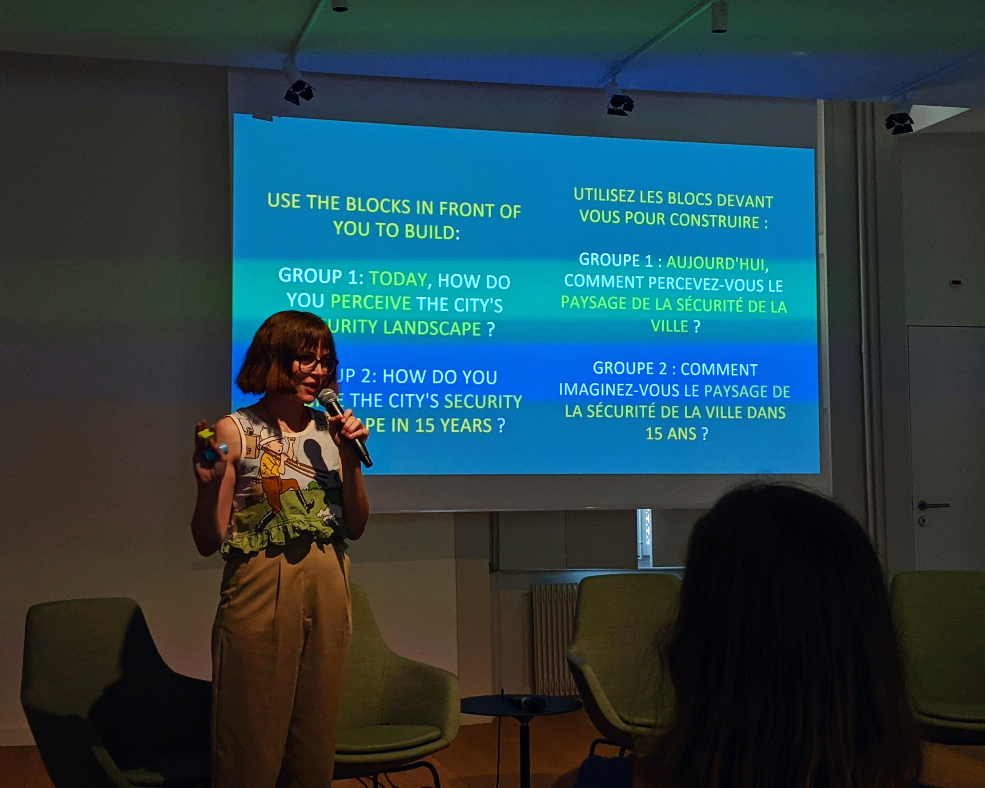 Hannah Mackaness at the event “Geneva in the Digital Age: Exploring Emerging Questions from the First Year of Edgelands Geneva” at Maison Rousseau presenting the activity “Surveillance Narratives.” June 15, 2023.